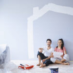 big home renovation project showing kitchen and living room transformation with construction workers and materials