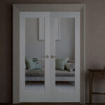 Modern glazed internal doors with clear glass panels in contemporary home hallway