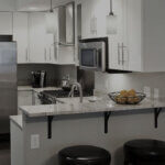 Small kitchen renovation before and after showing compact space transformation with white cabinets and smart storage