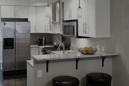 Small kitchen renovation before and after showing compact space transformation with white cabinets and smart storage