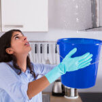 Common plumbing problems in apartments showing leaky faucet and clogged drain in rental unit