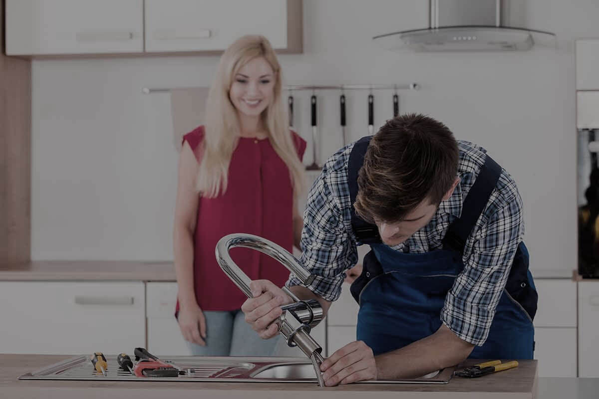 Licensed gas plumber Gold Coast installing gas appliance with safety equipment and tools