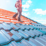 Professional roofers in Richmond installing new roof on residential home with modern tools and safety equipment