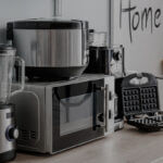 Modern kitchen showing right appliances for your kitchen including stainless steel refrigerator, gas range, and dishwasher in efficient layout