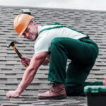 Professional roofing services in Lexington Kentucky contractor installing asphalt shingles on residential home roof
