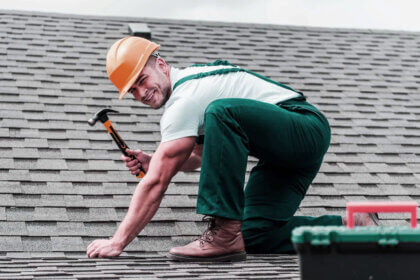 Professional roofing services in Lexington Kentucky contractor installing asphalt shingles on residential home roof