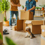 Young woman using smartphone apartment hunting app while sitting in modern living room with moving boxes