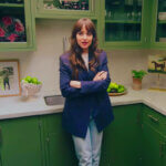 Dakota Johnson kitchen with green cabinets painted in Benjamin Moore Alligator Alley showing small kitchen design ideas
