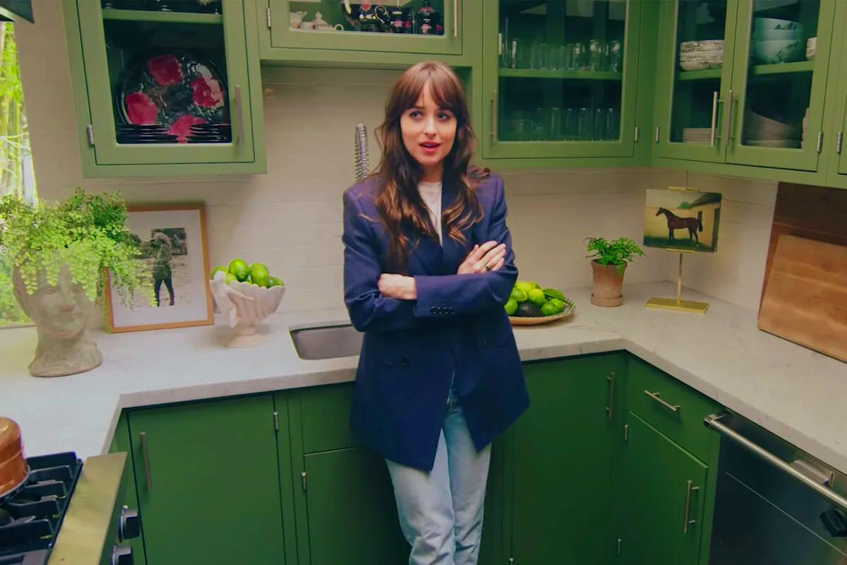 Dakota Johnson kitchen with green cabinets painted in Benjamin Moore Alligator Alley showing small kitchen design ideas