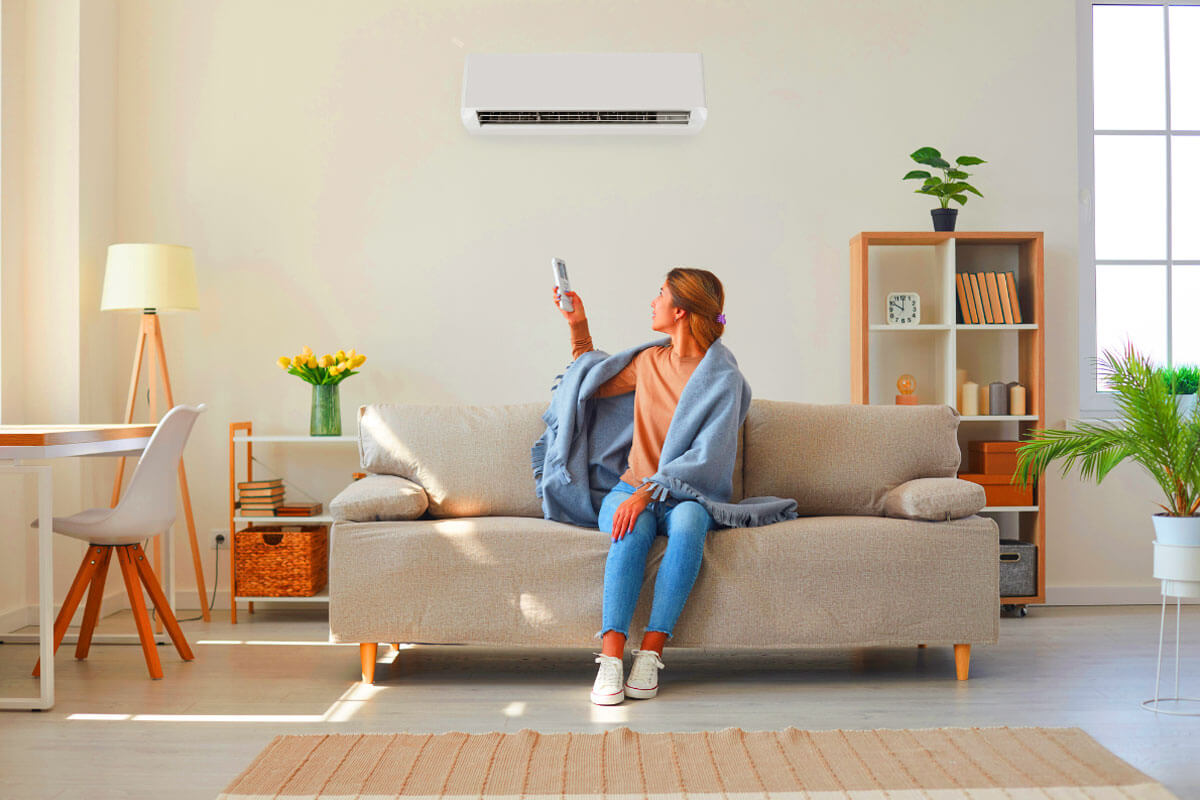 Homeowner learning how to buy a new HVAC system with contractor showing efficiency ratings and cost estimates