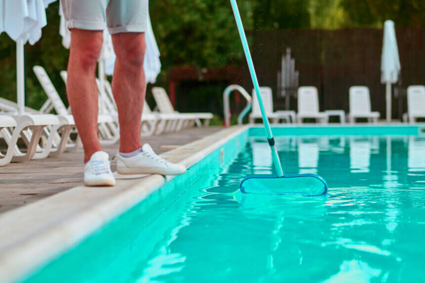 Homeowner checking swimming pool contractor credentials and licenses during pool builder selection process