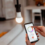 Smart lighting setup at home showing smart bulbs and switches installation process with smartphone app control