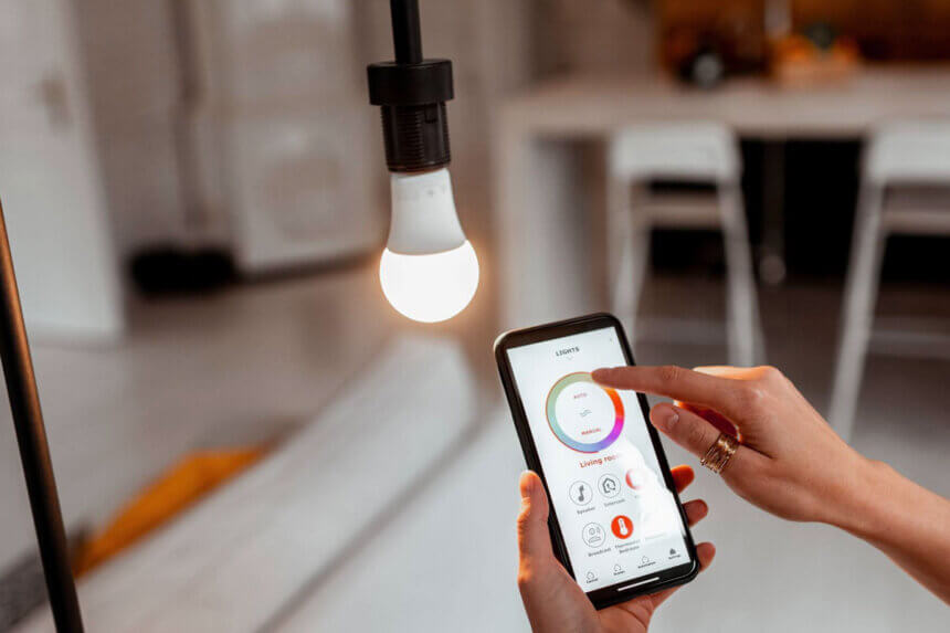 Smart lighting setup at home showing smart bulbs and switches installation process with smartphone app control