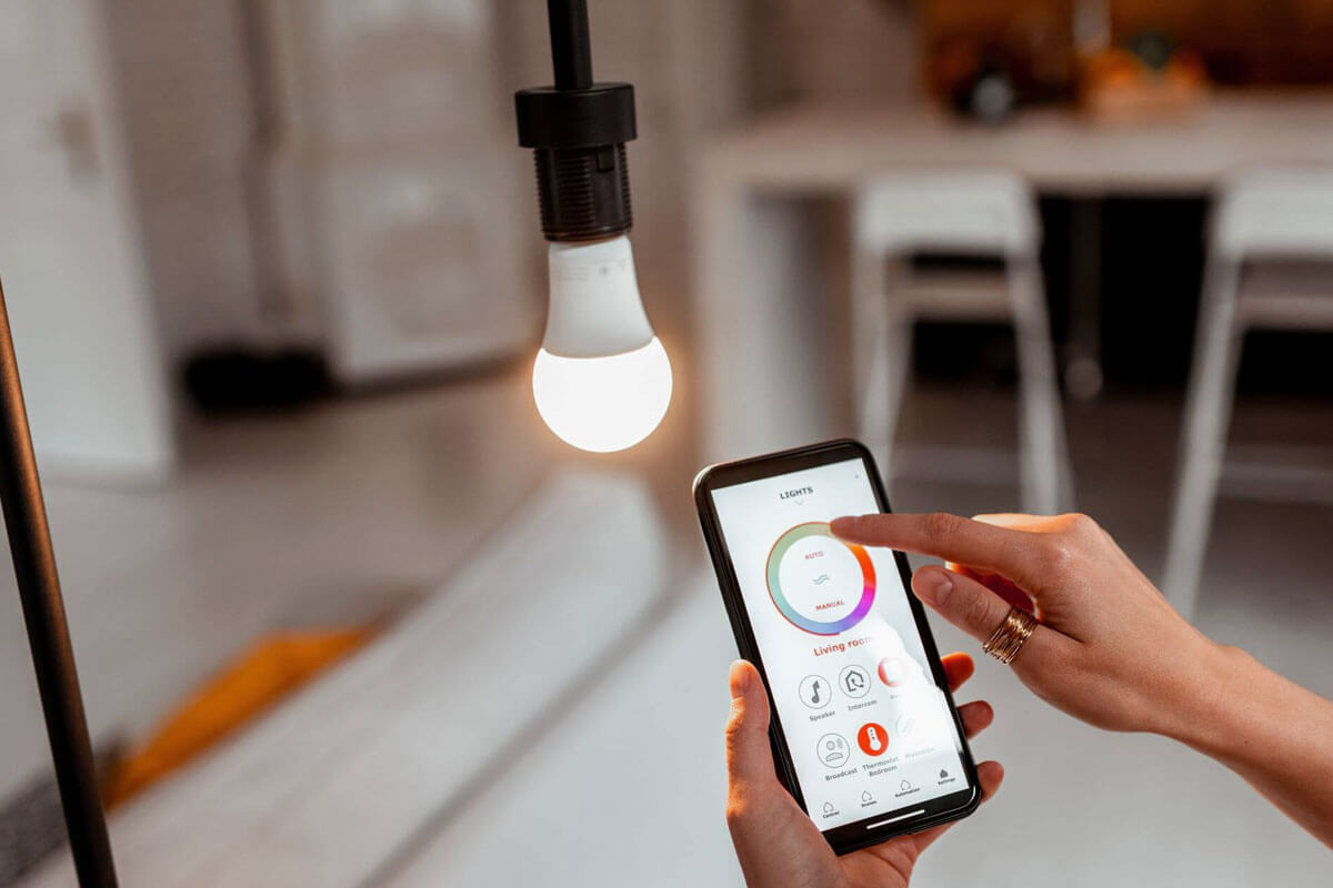 Smart lighting setup at home showing smart bulbs and switches installation process with smartphone app control
