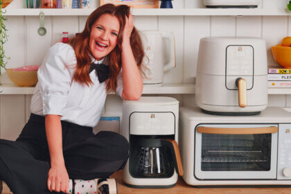 Best kitchen appliances for housewarming gifts including air fryer stand mixer and coffee maker on modern kitchen counter