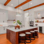 Kitchen cabinet refacing ideas showing before and after transformation with sage green cabinets and new hardware