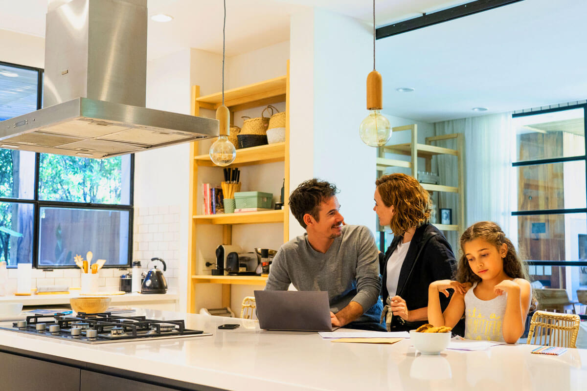 Kitchen remodeling specialists working on cabinet installation in modern home renovation project