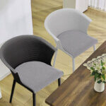 White outdoor stackable plastic chairs arranged on patio showing weather resistant design and space saving storage capability