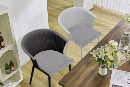 White outdoor stackable plastic chairs arranged on patio showing weather resistant design and space saving storage capability