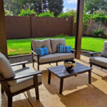 Polywood pool furniture chaise lounge chairs around swimming pool deck with HDPE recycled plastic construction