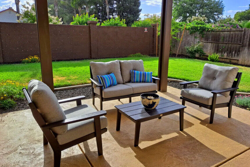 Polywood pool furniture chaise lounge chairs around swimming pool deck with HDPE recycled plastic construction