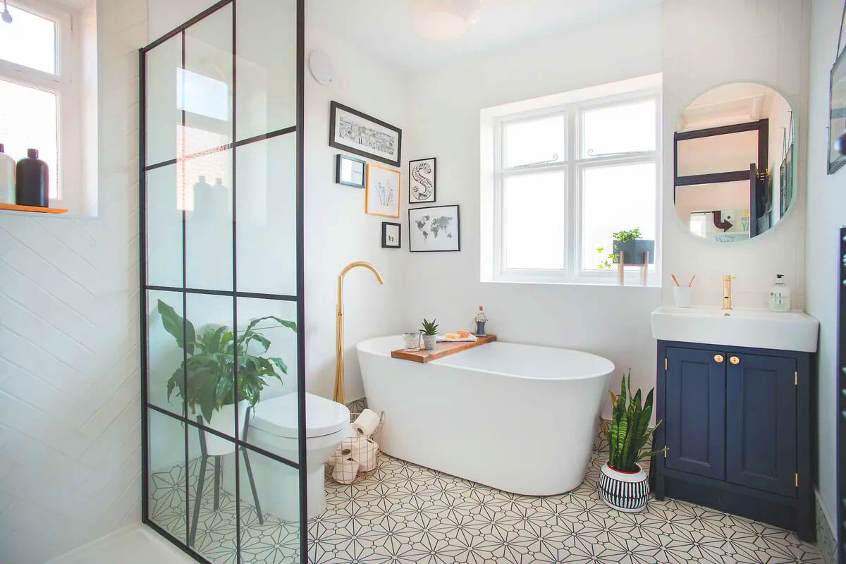 Small bathroom decor ideas on a budget showing floating vanity with under cabinet lighting and affordable accessories