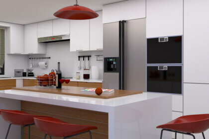 Small modular kitchen with L-shaped layout showing white cabinets, compact storage solutions, and space-saving design for tiny homes