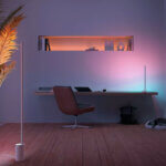 Smart floor lamp with LED lights and voice control in modern living room setting with wireless connectivity features