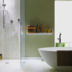 Steam shower installation process showing waterproofing membrane and steam generator setup in modern bathroom renovation