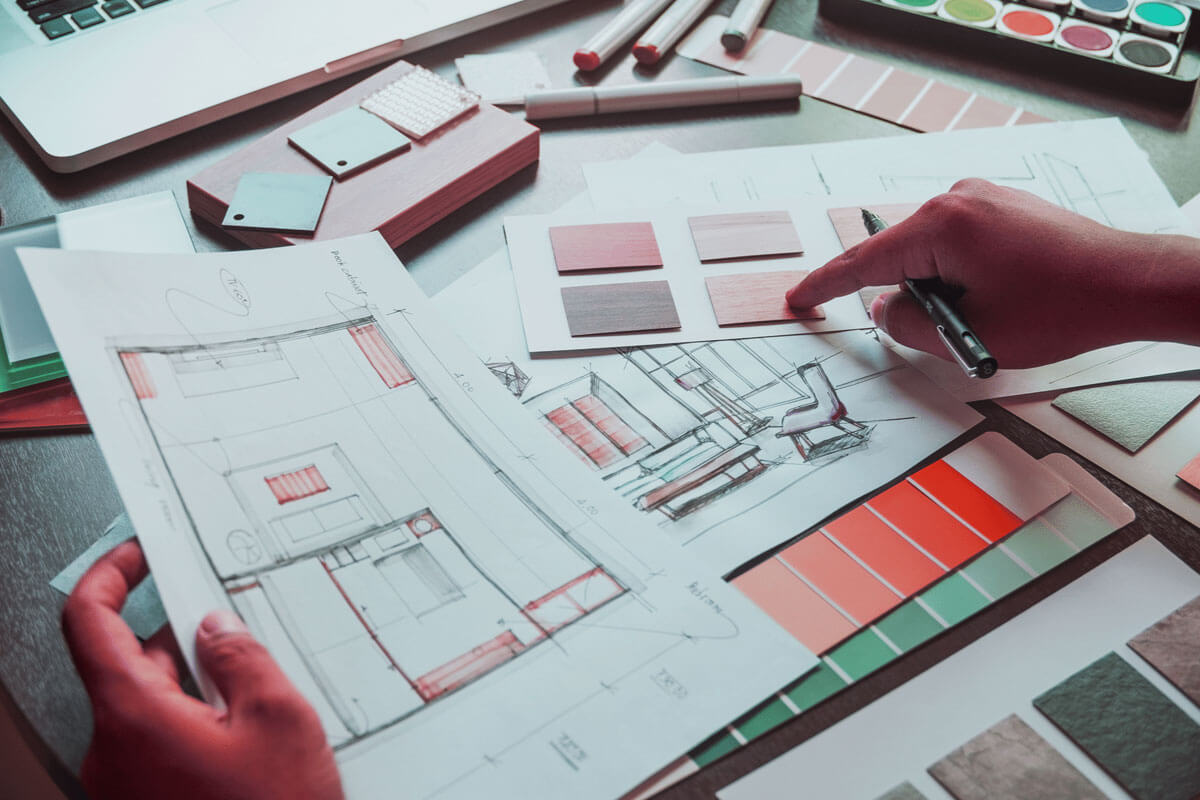 Step-by-step home renovation checklist with planning documents and tools on table