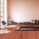 Wide plank engineered wood flooring installation in modern home showing natural oak grain pattern and stability benefits