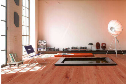 Wide plank engineered wood flooring installation in modern home showing natural oak grain pattern and stability benefits