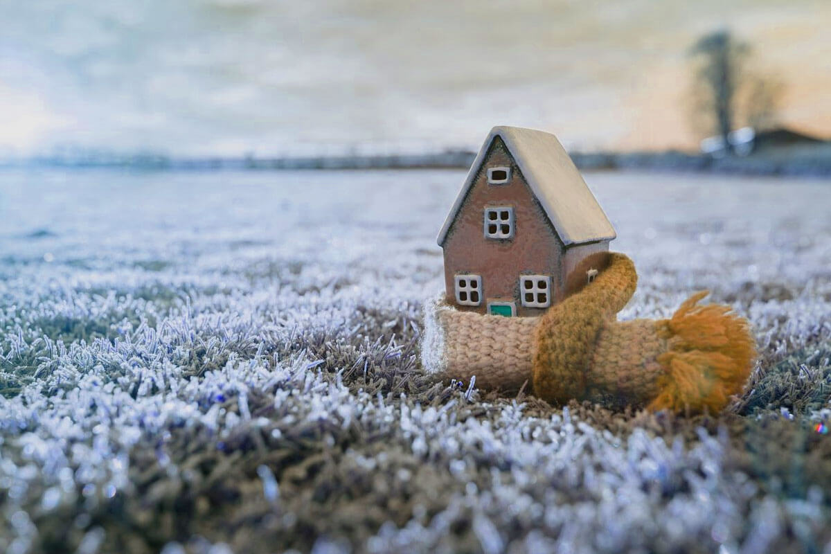 Winter home maintenance tips checklist showing heating system inspection and pipe insulation for cold weather protection