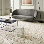 Polished terrazzo floors with marble chips and glass aggregates in modern interior design