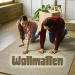 Two people exercising on Wollmatten natural wool mat in modern living room demonstrating comfort and eco-friendly home fitness use