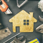 Homeowner using Wutawhelp guides for homes to fix leaky faucet with basic tools