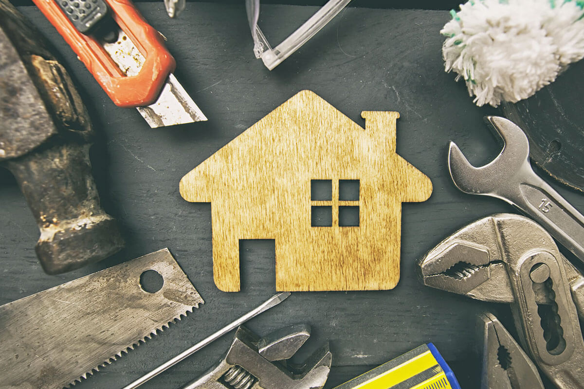 Homeowner using Wutawhelp guides for homes to fix leaky faucet with basic tools