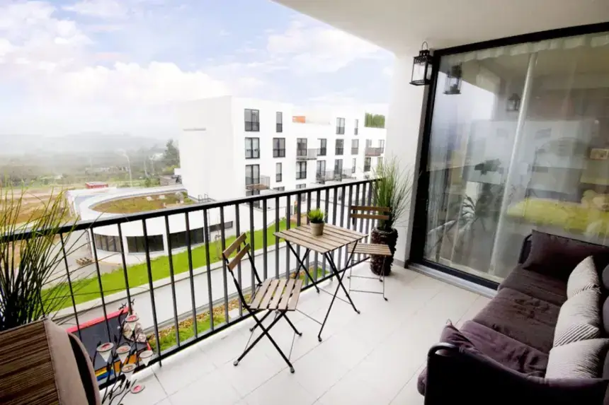 modern balcony with stylish furniture and greenery for balcony upgrades