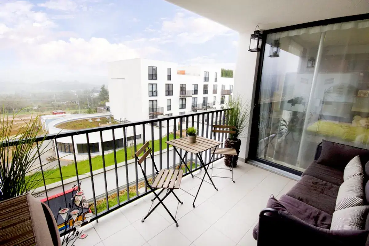 modern balcony with stylish furniture and greenery for balcony upgrades