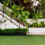 Decoradyard garden tips showing outdoor living space with smart irrigation and native plants