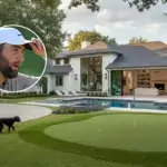 Scottie Schefflers House In Dallas featuring modern white exterior, swimming pool with spa, putting green, and mature oak trees in exclusive Bluffview neighborhood