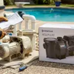 Professional installing Pentair IntelliFlo VSF pool pump next to old pump during Pentair pool pump replacement