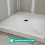 pre sloped shower pan for tile installed in unfinished shower with central drain and cement board walls