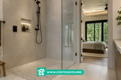 Zero threshold shower with frameless glass enclosure, recessed floor drain, large-format tile, and matte black fixtures
