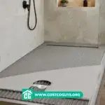 Tile Redi Curbless Shower Pan installation with exposed mortar bed, floor drain, and tiled walk-in shower under construction