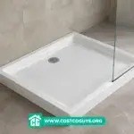 White acrylic 30 x 36 shower base with center drain installed in a bathroom alcove