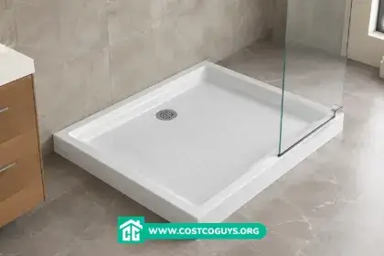 White acrylic 30 x 36 shower base with center drain installed in a bathroom alcove