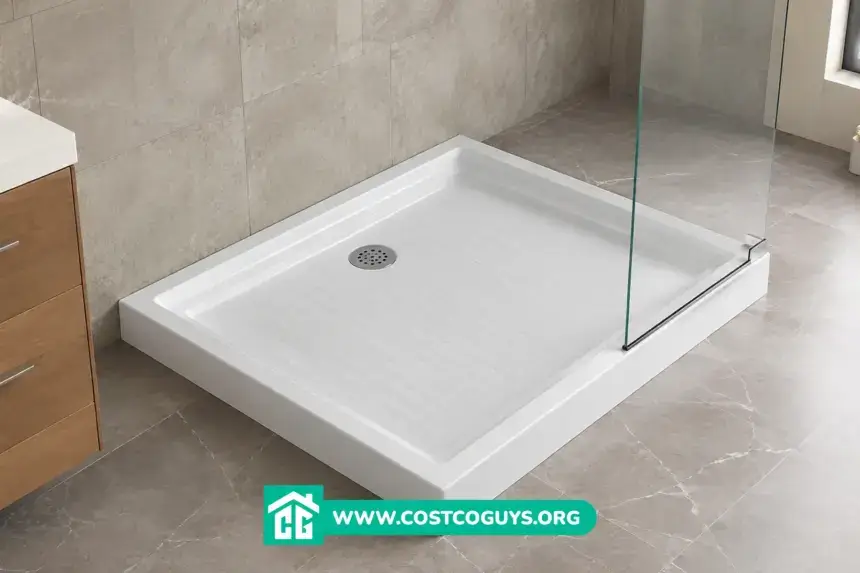 White acrylic 30 x 36 shower base with center drain installed in a bathroom alcove