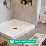 white 36 inch shower base with center drain set into a framed bathroom alcove