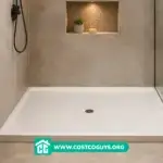 White rectangular 60 x 48 Shower Pan installed in a tiled bathroom with glass shower panel